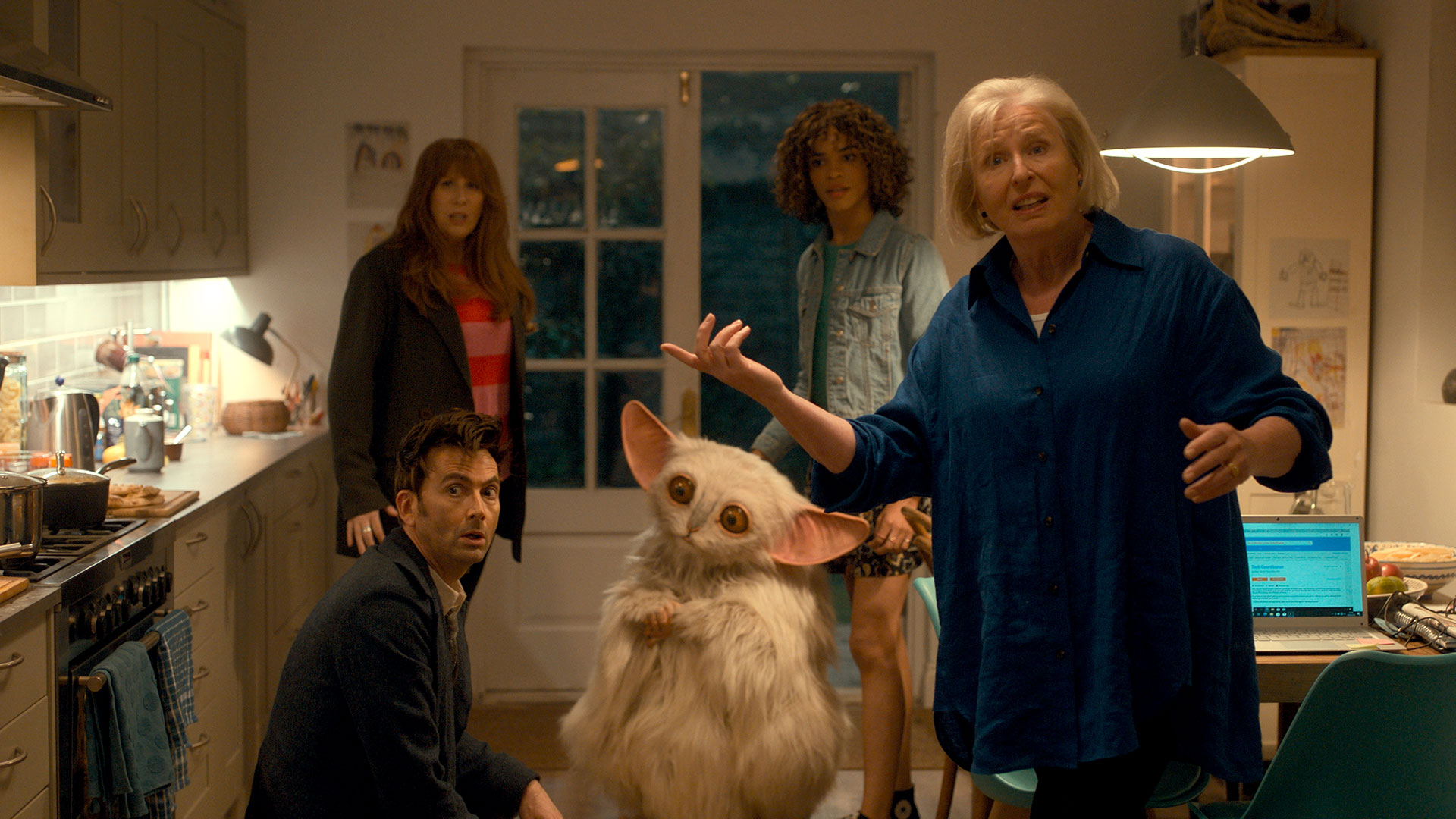 The Fourteenth Doctor, Rose Noble, Donna Noble, Sylvia Noble and the Meep in a Kitchen