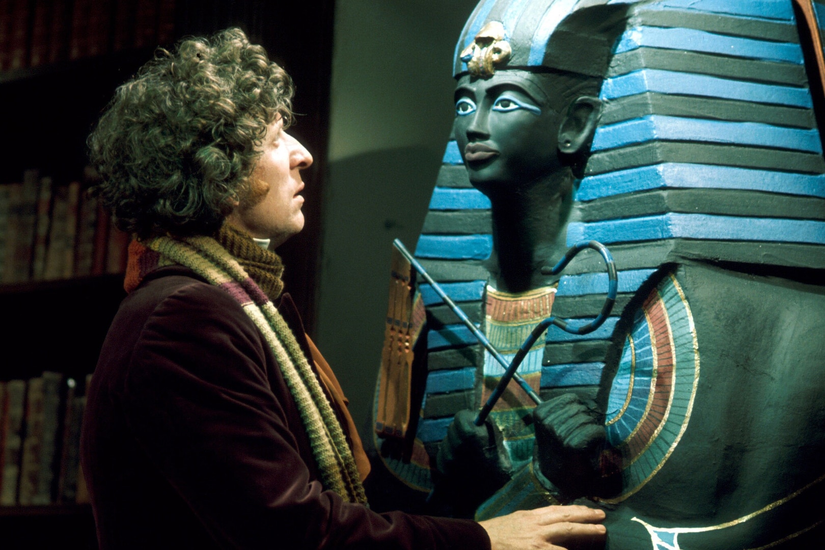 The Fourth Doctor (Tom Baker) inspects a sarcophagus in 'Pyramids of Mars'.