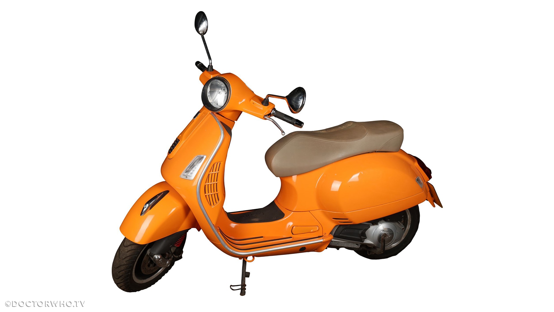 Lot 7: Melanie Bush's (Bonnie Langford) Orange Vespa and Helmets