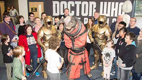 The Teller and guards surrounded by children at the Doctor Who Experience