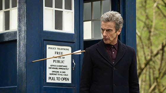 Twelfth Doctor looking at an arrow fired into the TARDIS door