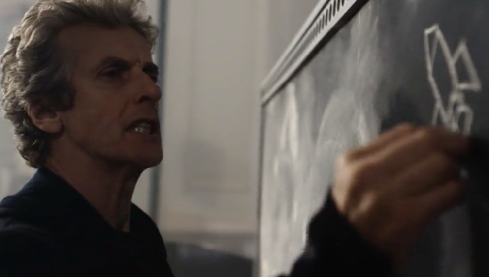 Image of Peter Capaldi as The Twelfth Doctor writing on a blackboard