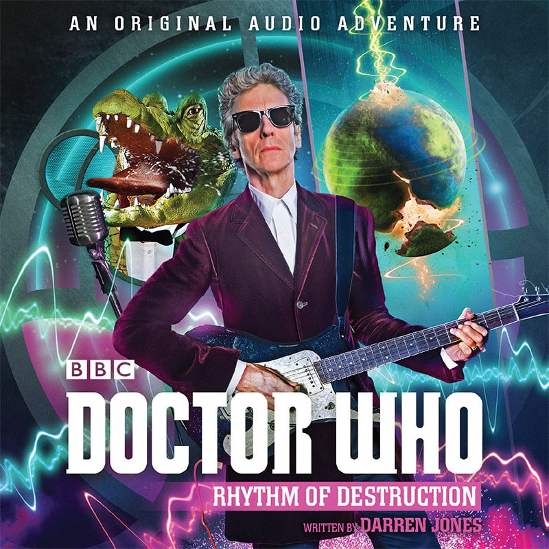 Image of Peter Capaldi playing a guitar with a crocodile behind him singing into a mic