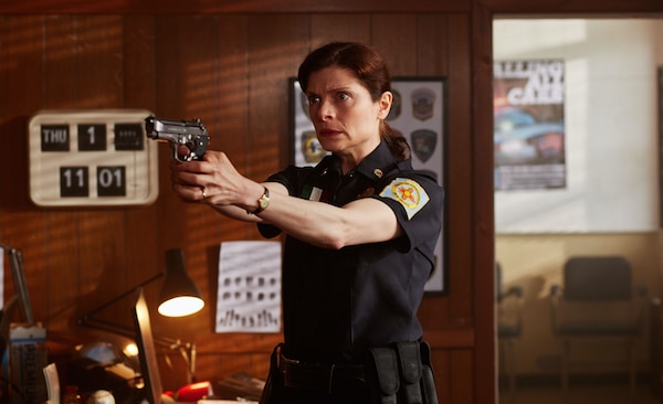policewoman holding a gun